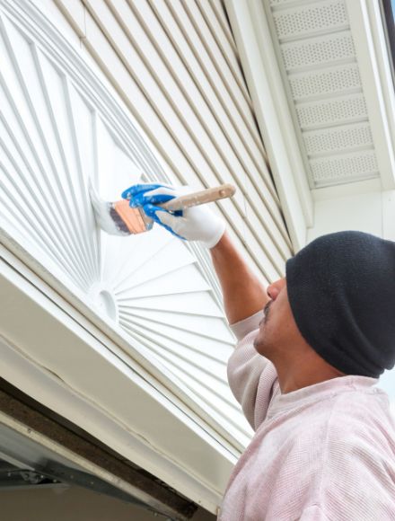 Worker painting walls